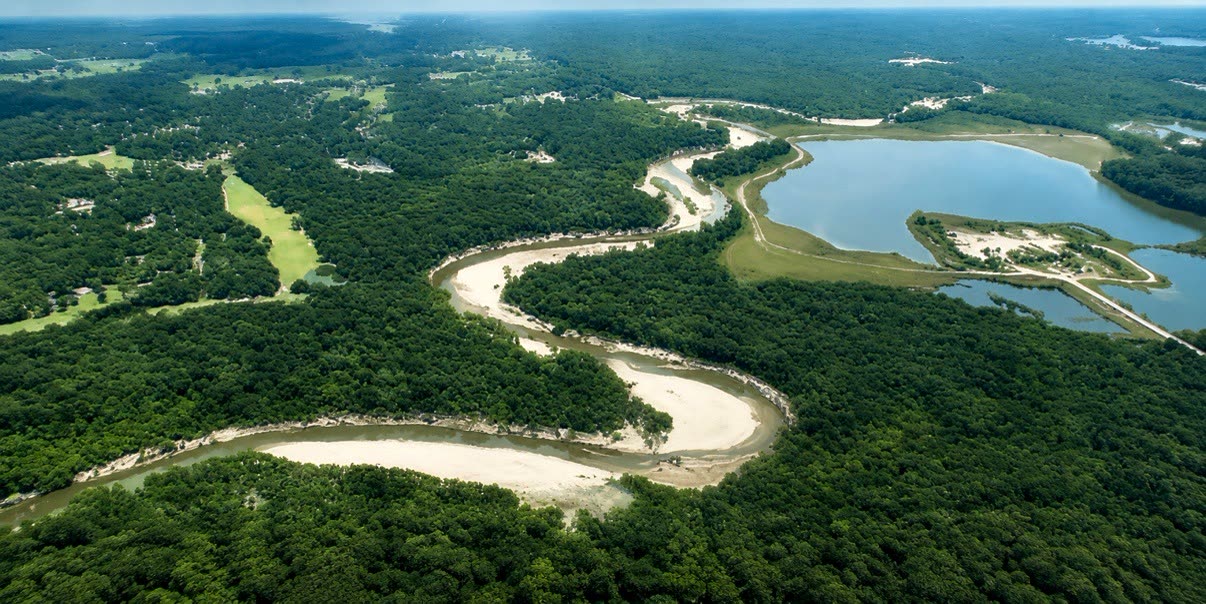 Aerial panorama of the S-shaped white-sand bay, river, forest and lake